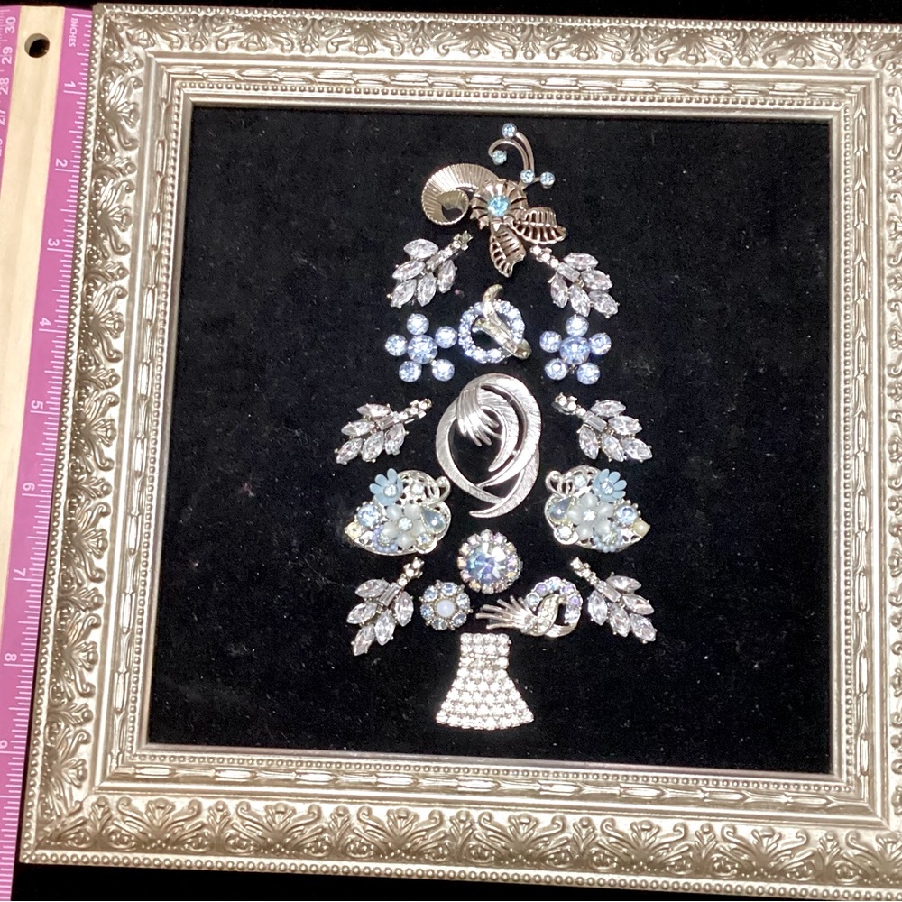 Beautiful blue, zirconia, silver jewelry on a black velvet Christmas tree
